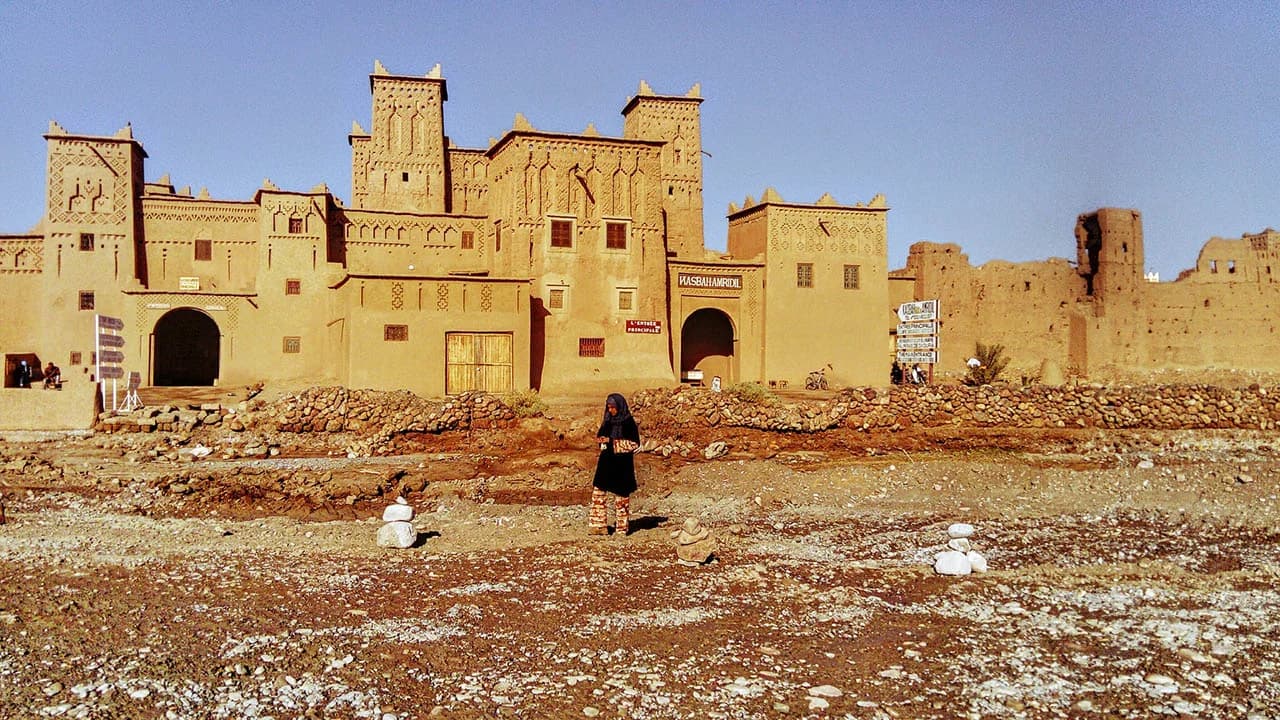 Solo traveler exploring Moroccan kasbah with private guide